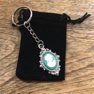NWOT Striking mint green and silver cameo keychain